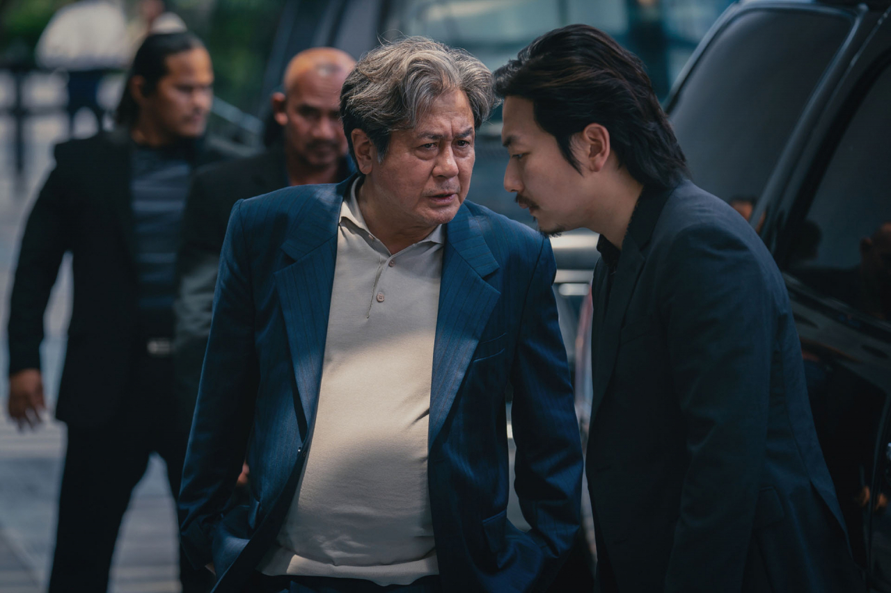 Top actor Choi Min-sik (left) and Lee Dong-hwi play casino mogul Cha Moo-sik and his associate Jung-pal, respectively, in “Big Bet” (Walt Disney Co. Korea)