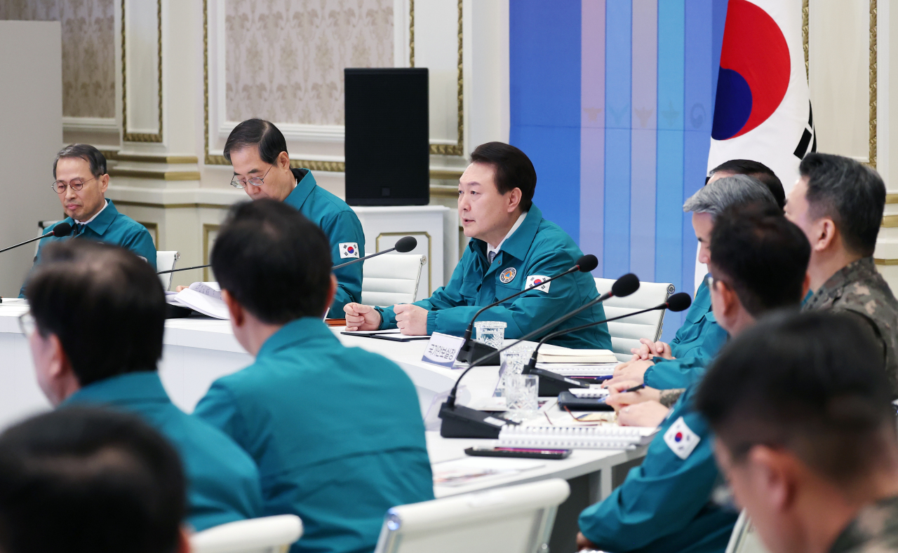 President Yoon Suk Yeol (3rd from L) speaks during a meeting on integrated defense at Cheong Wa Dae, the former presidential office, in Seoul on Feb. 8, 2023. The meeting is aimed at discussing ways to ensure unity of the administrative, military and police branches, as well as civilians, in the country`s defense. (Yonhap)