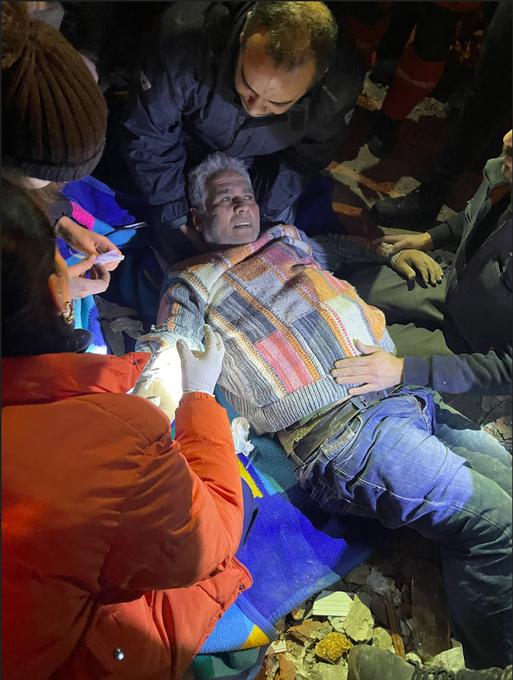 A Turkish man is pulled from the rubble by Korean rescuers dispatched to quake-ravaged Antakya of Hatay province, Turkey, on Thursday. (KDRT)