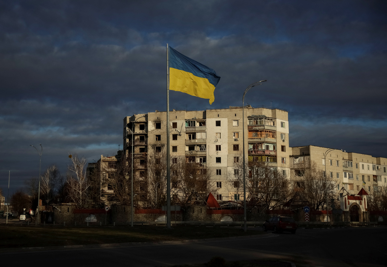 A Ukrainian national flag flutters near the buildings destroyed by Russian military strike, amid Russia`s invasion of Ukraine, in the town of Borodianka, in Kyiv region, Ukraine February 15, 2023. (Photo - Reuters)