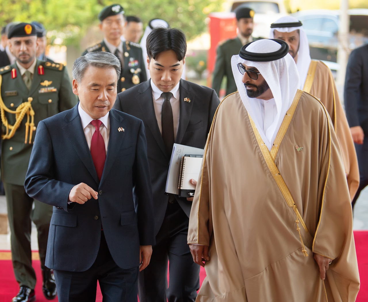 South Korean Defense Minister Lee Jong-sup (L) speaks to his UAE counterpart, Mohammed Al Bowardi, during a visit to the latter`s ministry in Abu Dhabi, the United Arab Emirates, on Feb. 21, 2023. (South Korea`s Ministry of National Defense)