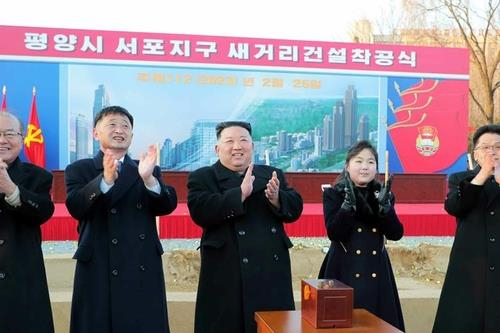This photo shows North Korean leader Kim Jong-un (at the center) attending a groundbreaking ceremony for a new street in Pyongyang. ( North's official Korean Central News Agency)