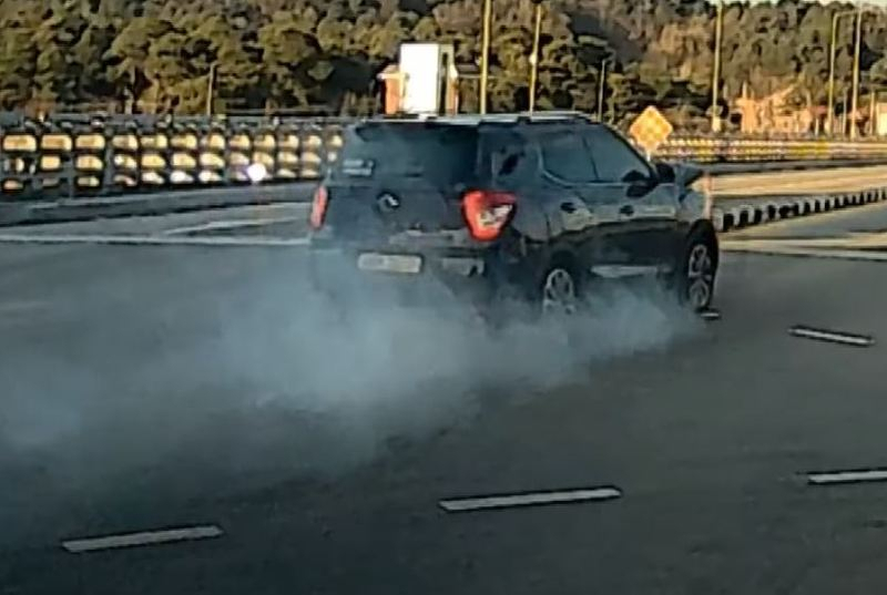 This photo captured from local broadcaster KBS' news coverage shows a car dashing with smoke on Dec. 6 in Gangneung, Gangwon Province. (KBS)