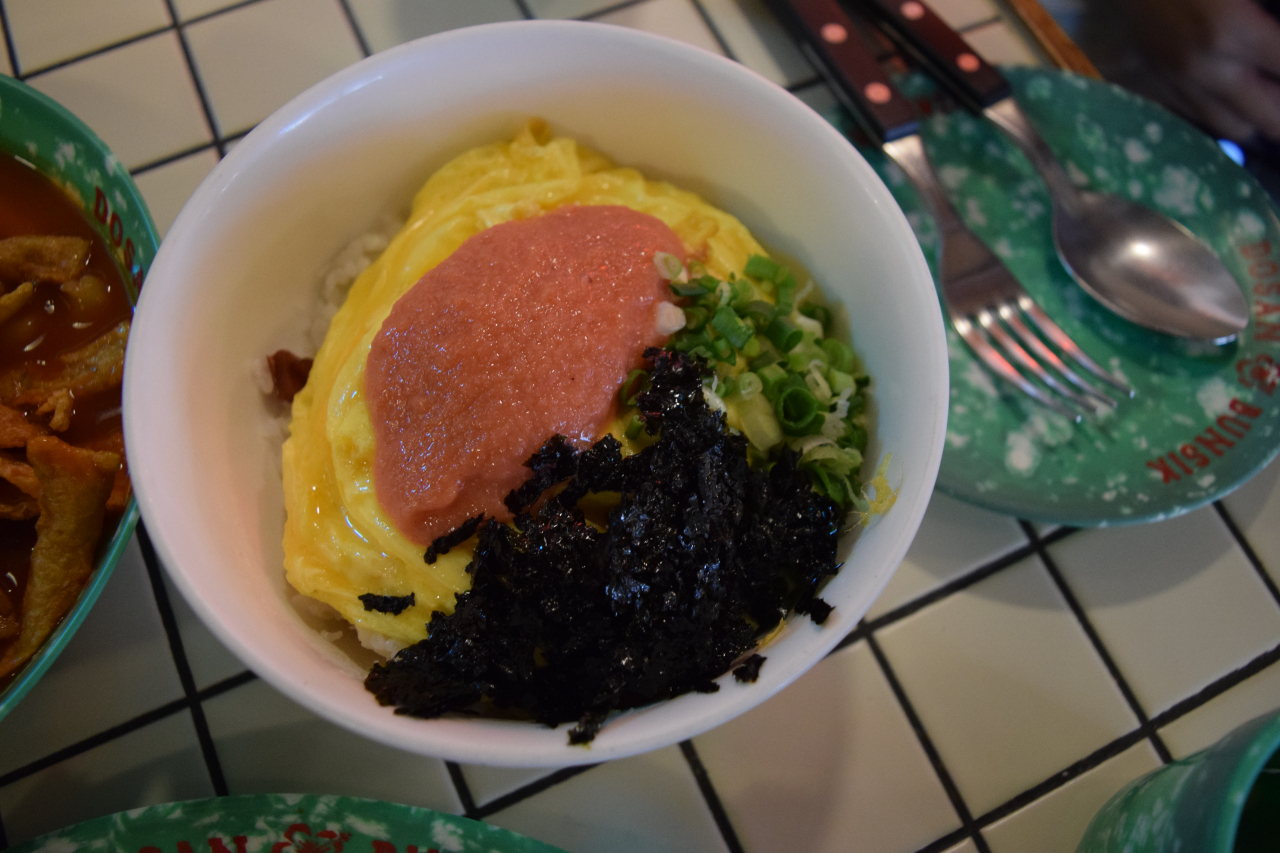 Myeongnan egg rice, rice topped with salted pollack roe and egg at Dosan Bunsik (Kim Hae-yeon/ The Korea Herald)