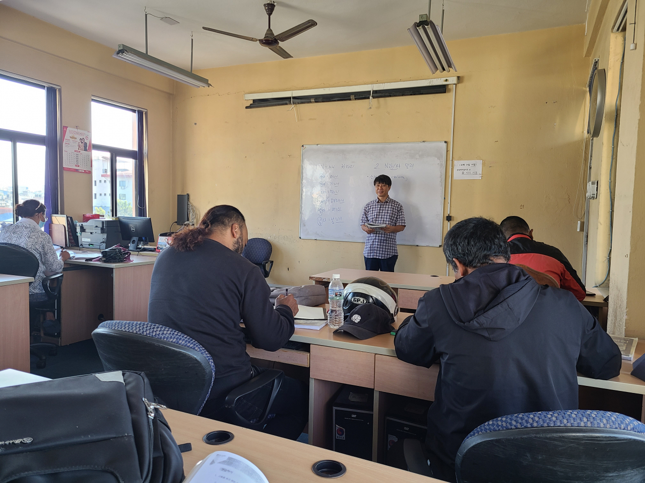 Hyeon Woo-taek, after spending 20 years teaching at Korean elementary schools, teaches Korean to a group of Nepalese students at a university in Kathmandu. (Courtesy of Hyeon)