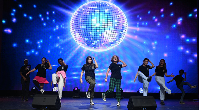 Family members of the diplomatic corps perform BTS dynamite during the Global K-Culture festival at the World K-Pop Center in Jung-gu, Seoul, on Thursday. Hosted by the Korea Importers Association, the festival showcased cultural performances by Korean artists and family members of the diplomatic corps in support of South Korea's 2030 Busan World Expo bid. (Sanjay Kumar/The Korea Herald)