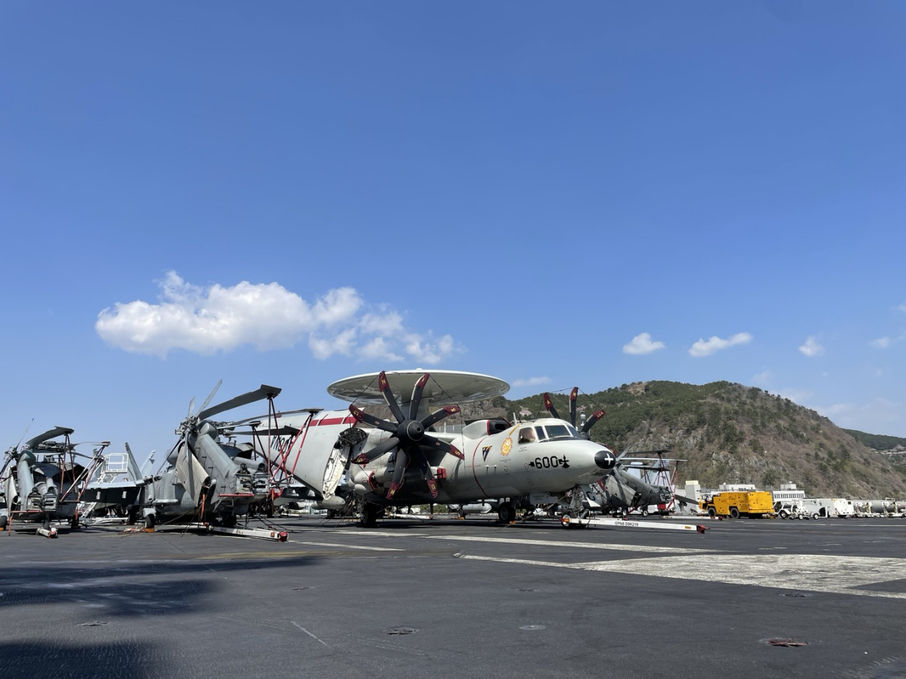 E-2 Hawkeye airborne early warning and battle management aircraft and other fighter jets are seen aboard the US nuclear-powered aircraft carrier USS Nimitz in South Korea's southeastern city of Busan on March 28, 2023. (Ji Da-gyum/ Korea Herald)