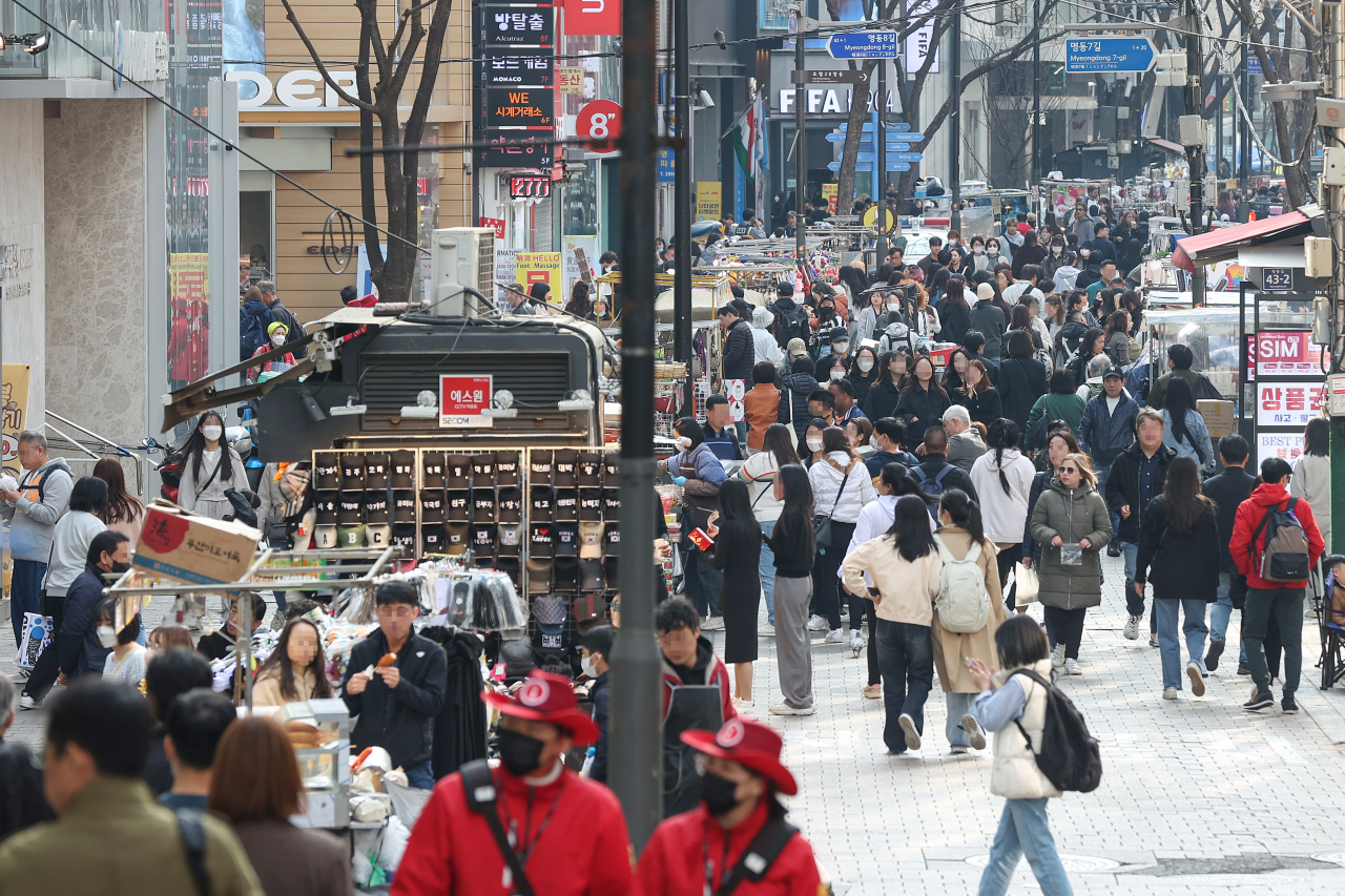 This photo, taken on Tuesday, shows a vibrant Myeongdong district in central Seoul, a scene restored after a period of desolation due to the COVID-19 outbreak. (Yonhap)