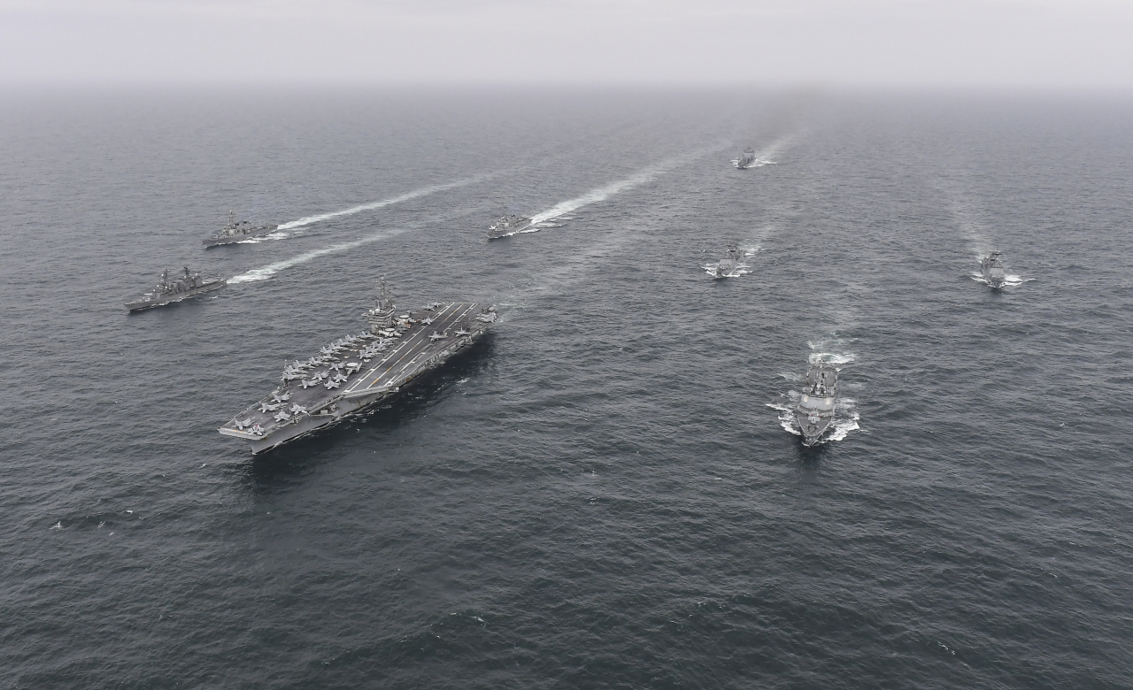 This photo from Tuesday shows the South, the United States and Japan holding a two-day trilateral naval exercise in waters south of the Korean Peninsula. (South Korean Navy)