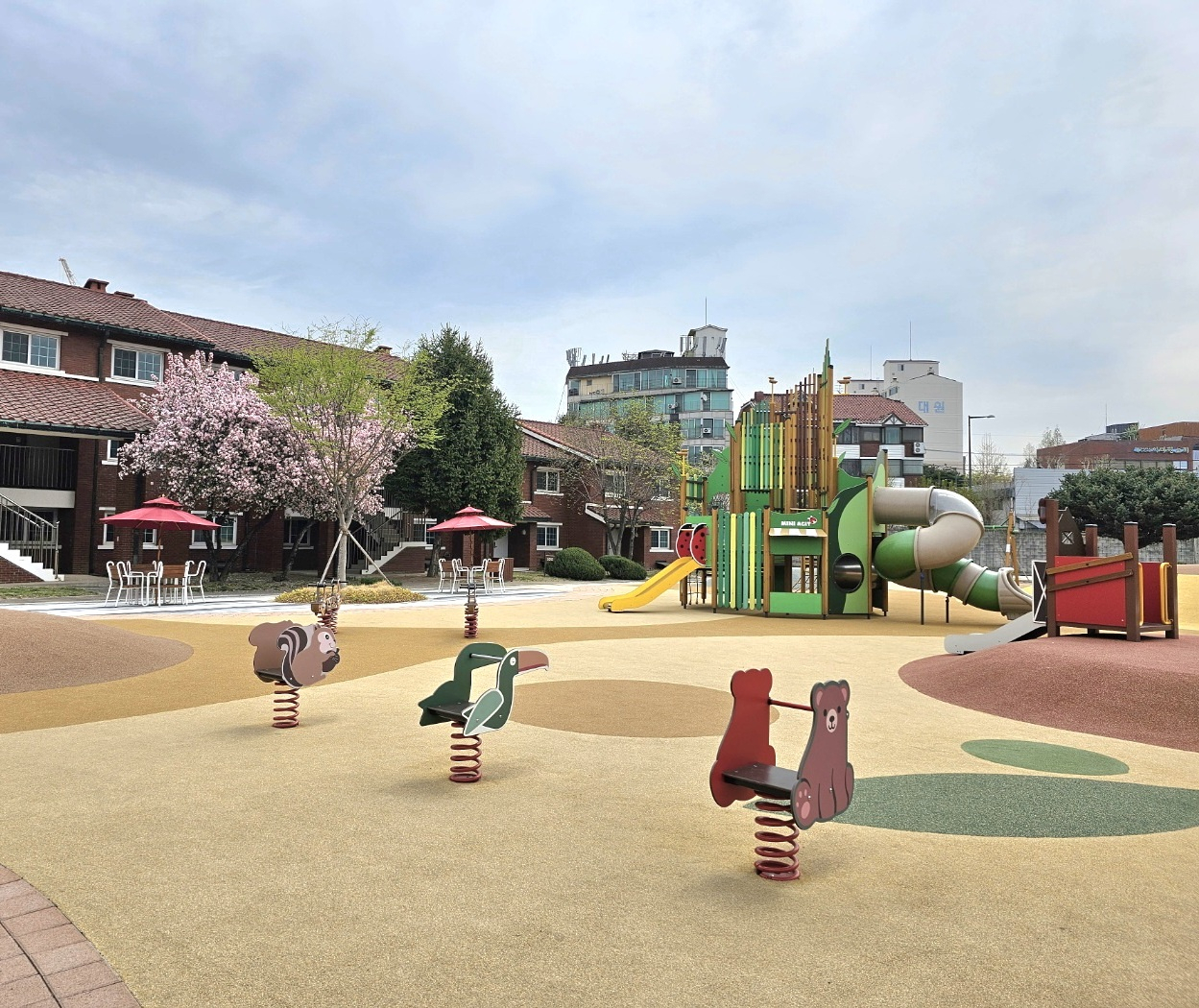 A playground for children with slides and seesaws (Choi Jae-hee / The Korea Herald)