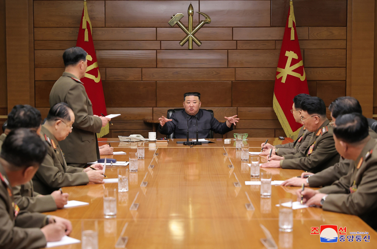 North Korean leader Kim Jong-un (center) presides over a meeting of the central military commission of the ruling Workers' Party on April 10, in this photo provided by the North's official Korean Central News Agency. (Yonhap)