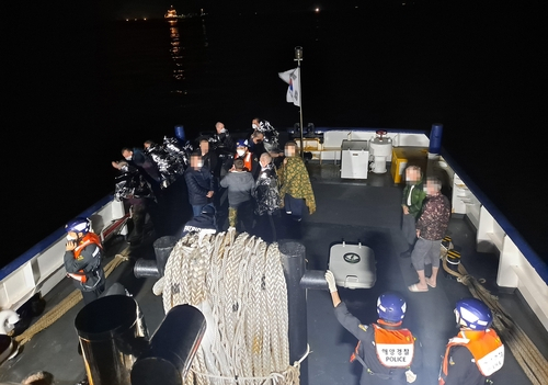 This photo shows rescued Russians on Friday. (South Korean Coast Guard)