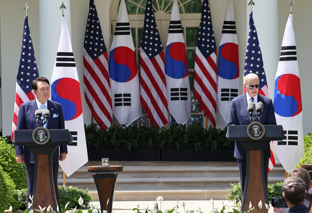 President Yoon Suk Yeol (left) and US President Joe Biden speak during a joint press conference following their summit at the White House in Washington on Wednesday. (Yonhap)