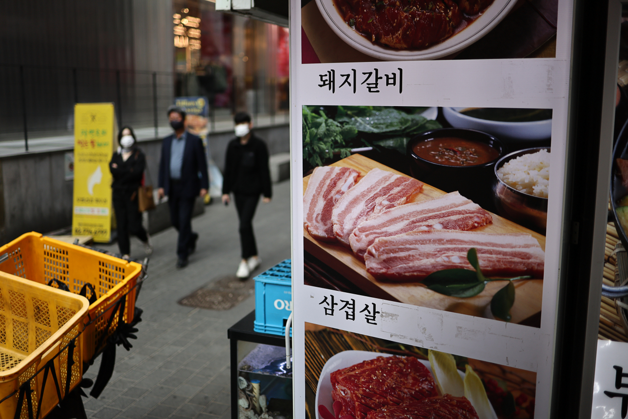 A restaurant menu is seen in Myeong-dong, central Seoul, on Sunday. (Yonhap)