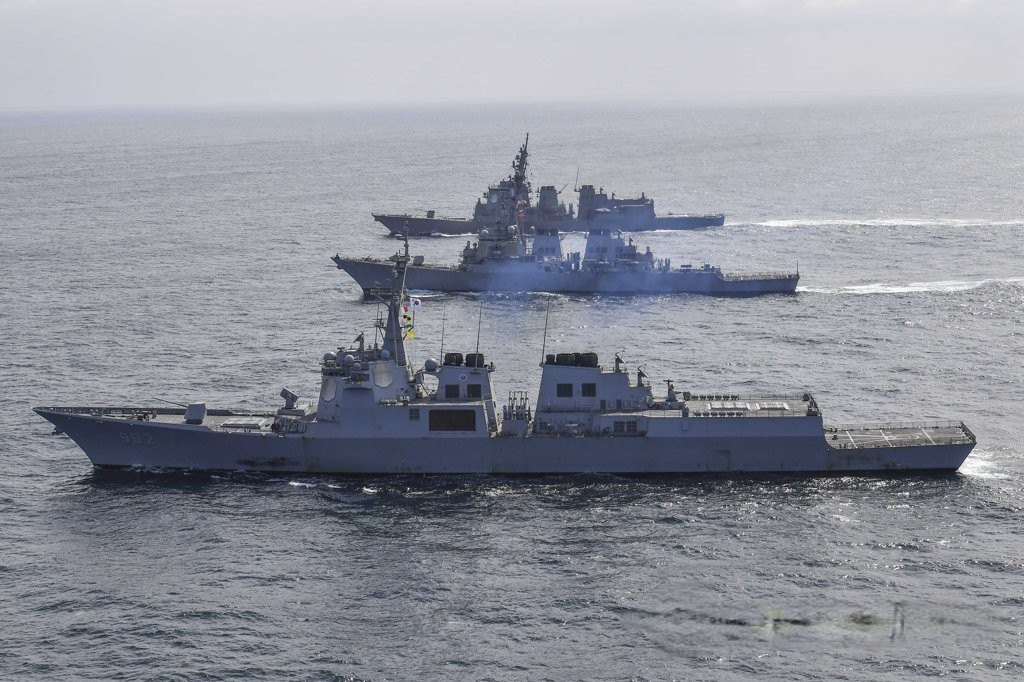 This file photo, released by the South Korean Navy on April 17, shows three Aegis-equipped destroyers -- the South's Yulgok Yi I (front), the Benfold (center) of the US Navy, and the JS Atago of the Japan Maritime Self-Defense Force -- sailing in waters off South Korea's east coast. (ROK Navy)