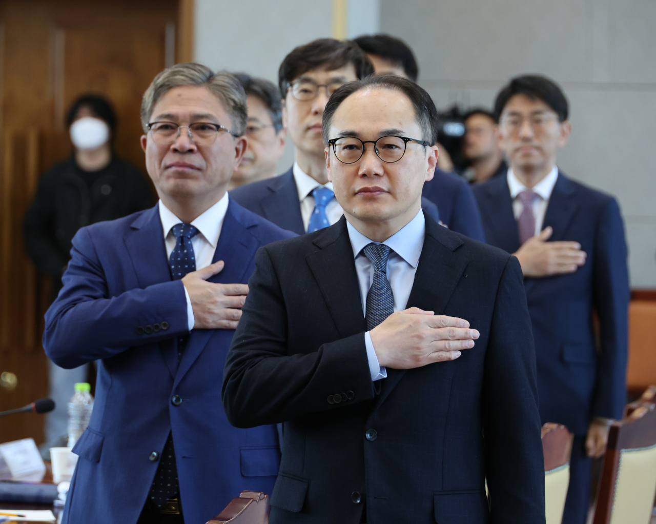 Prosecutor General Lee One-seok (front row) salutes the South Korean national flag at the high-ranking prosecutors' meeting held at the Supreme Prosecutors' Office headquarters in Seoul, Monday. (Yonhap)
