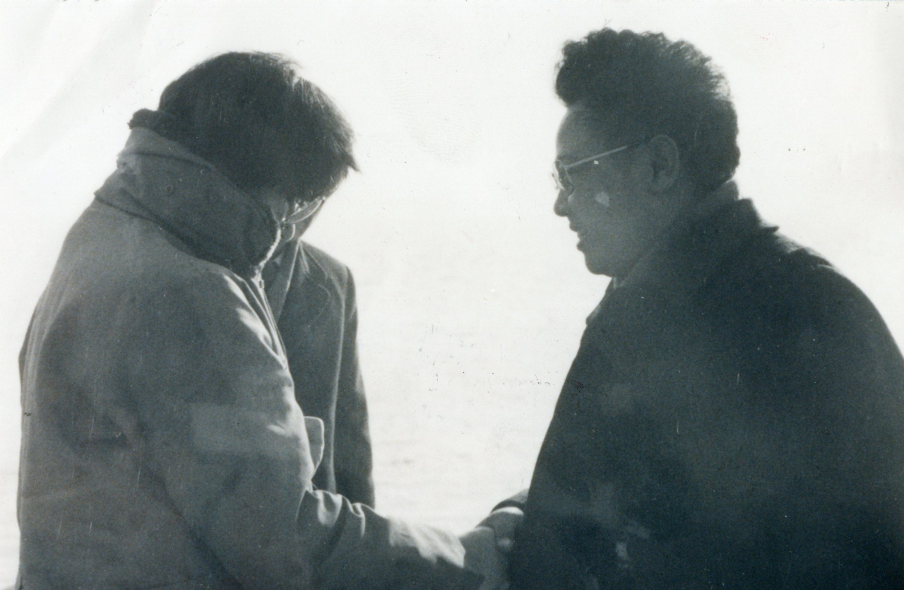 Kim Jong-il (right) welcomes Choi Eun-hee after she arrived at Nampo Port in North Korea in this Jan.22, 1978 file photo from an unknown source.