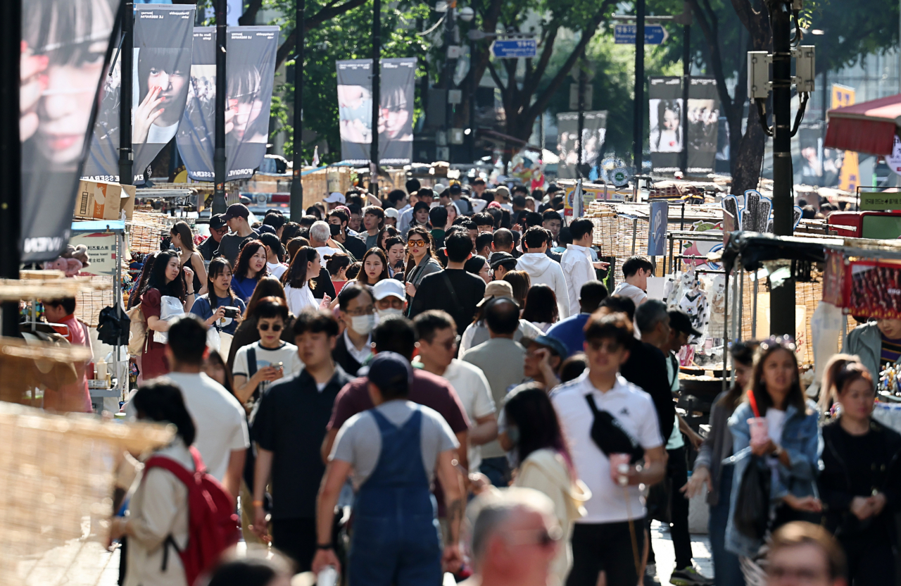 Bustling streets of Myeongdong after most of COVID-19 restrictions have been lifted.(Yonhap)