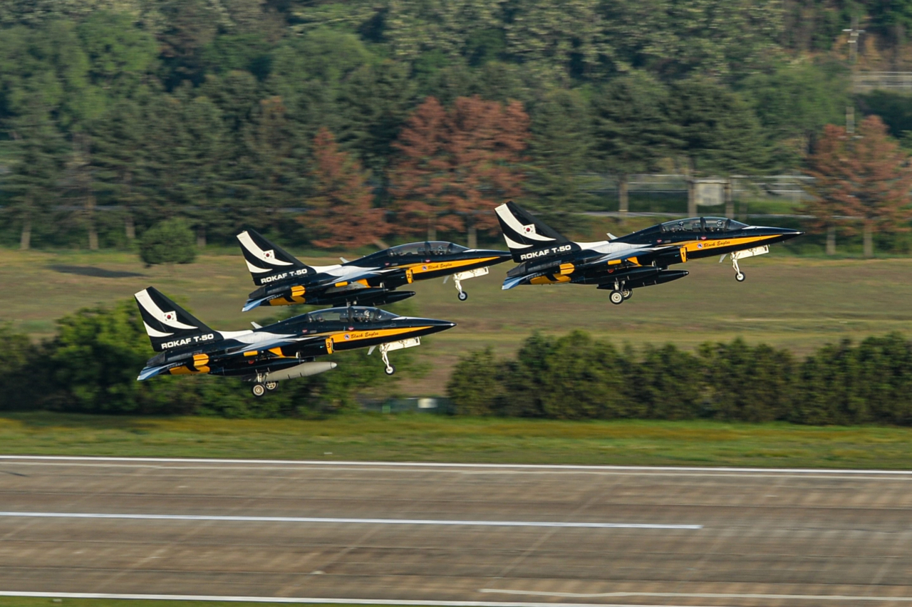 This file photo from last Wednesday shows T-50B aircraft of the armed service's aerobatic team taking off from an air base in Wonju, 87 kilometers east of Seoul, to take part in an air show in Malaysia. (Republic of Korea Air Force)