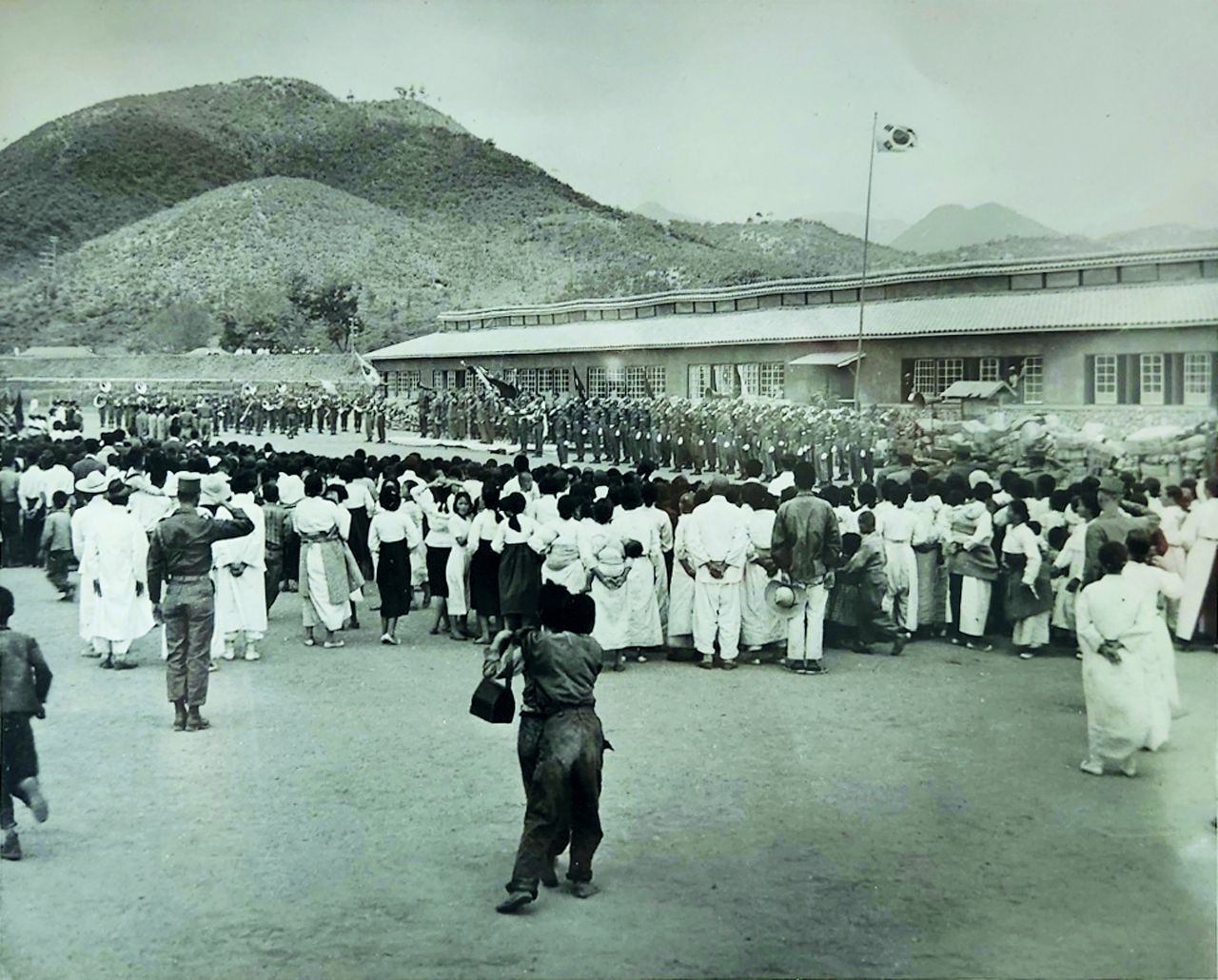 Koreans gather at a ceremony in Gapyeong, Gyeonggi Province, on May 29, 1954 where relief clothing from the US was distributed to Koreans in need. (Courtesy of Stephen Spina)