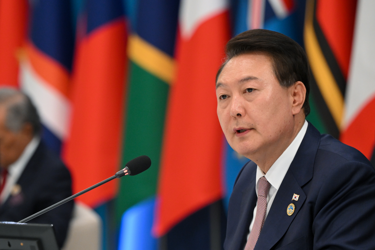President Yoon Suk Yeol speaks at a summit meeting with Pacific island leaders on Monday. (Yonhap)