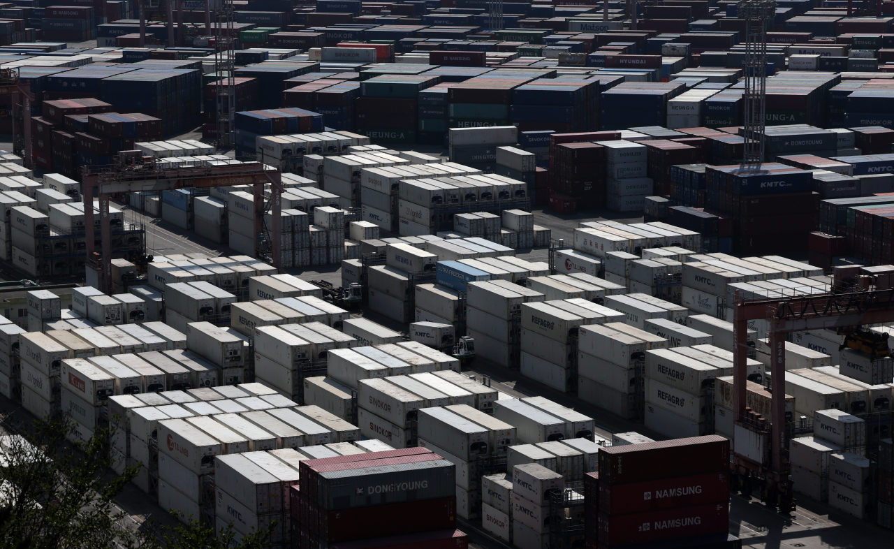 Containers are lined up for overseas shipment at the port of Busan on May 1. (Yonhap)