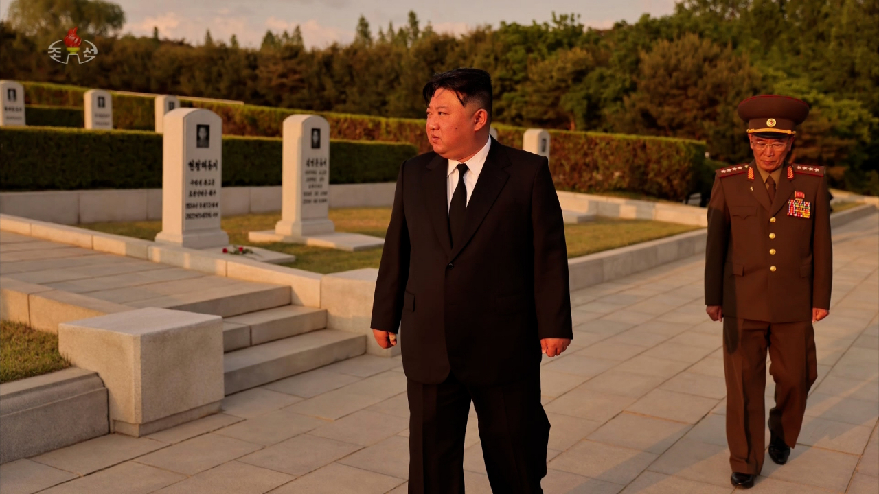 North Korean leader Kim Jong-un pays respect to the late former military official Hyon Chol-hae on May 19. (North Korean Central Television).
