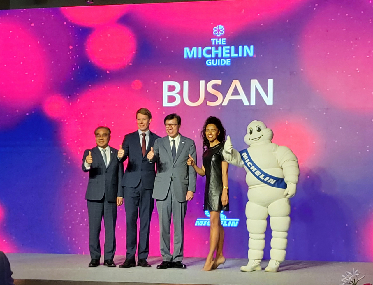 (From left) Busan Tourism Organization President Lee Jung-sil, Director of Michelin Guide Asia and Middle East Chris Gledhill, Busan Mayor Park Heong-joon and Michelin Guide Experiences Director Elisabeth Boucher-Anselin, pose during a press conference held Thursday at Park Hyatt Busan. (Kim Hae-yeon/ The Korea Herald)
