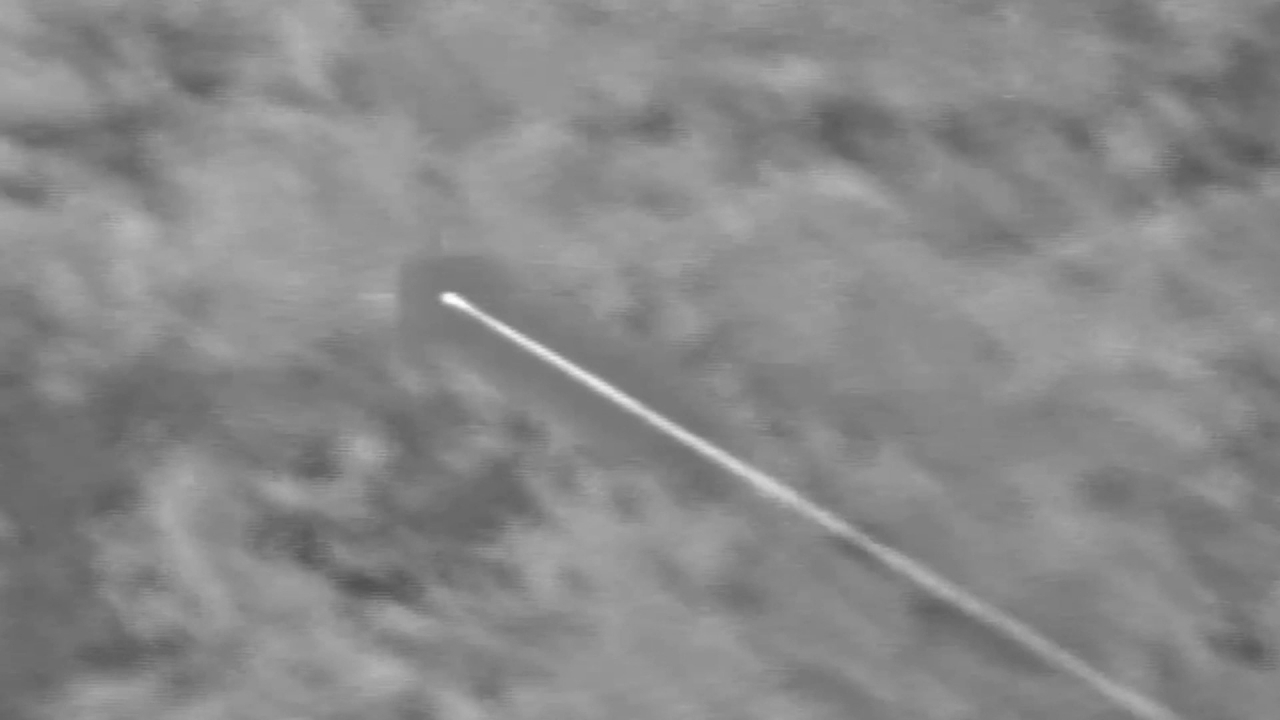 A second-stage booster of South Korea's homegrown long-range surface-to-air missile system is ignited and heads toward a target ballistic missile in this photo taken by an infrared camera on Tuesday. (Photo - Agency for Defense Development )