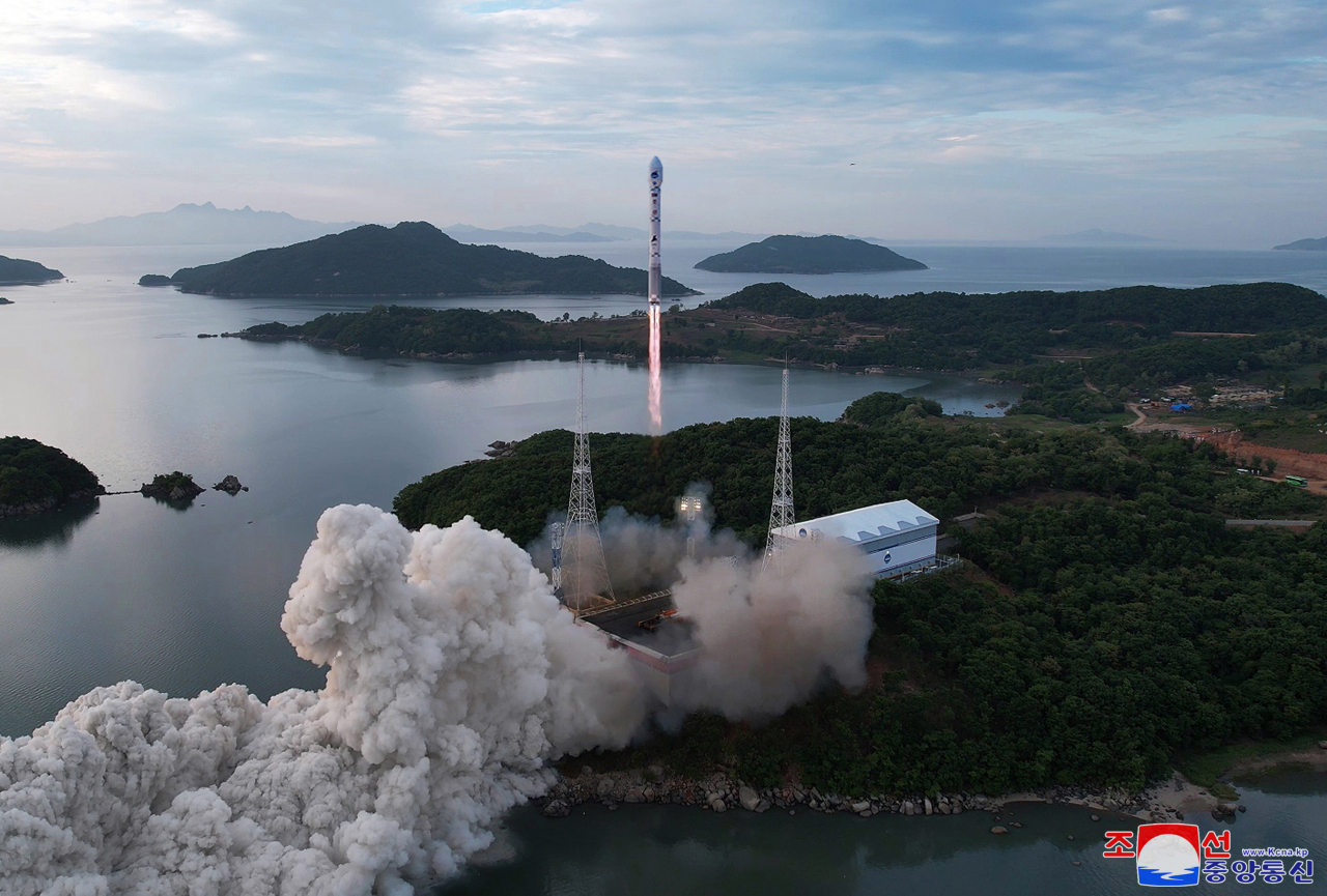 North Korea’s state-run Korean Central News Agency released two photos capturing the launch of the Chollima-1 rocket carrying North Korea’s first reconnaissance satellite. (Yonhap)