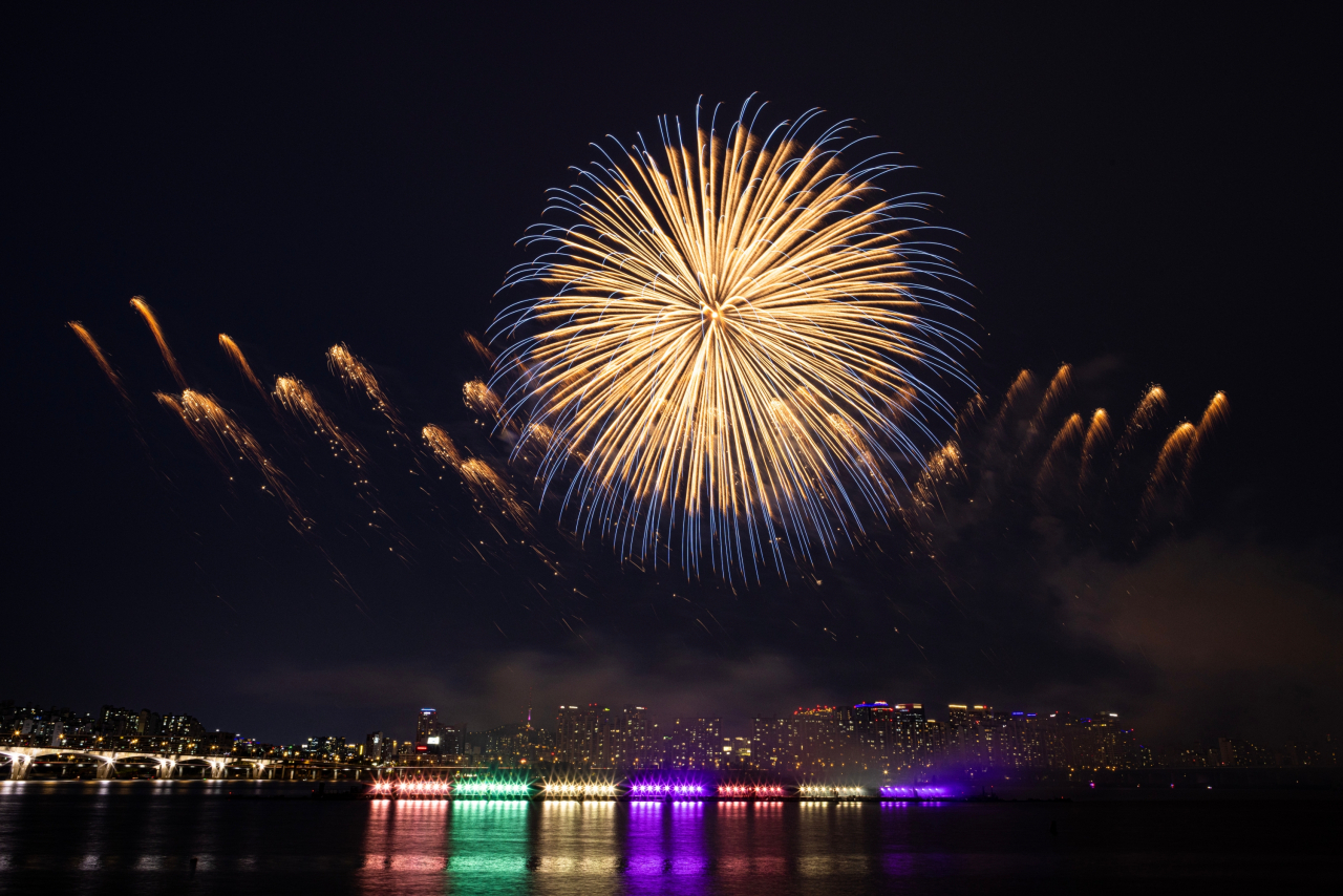 Fireworks are displayed over the Han River and Yeouido Hangang Park on Saturday during BTS' 10th anniversary festival 