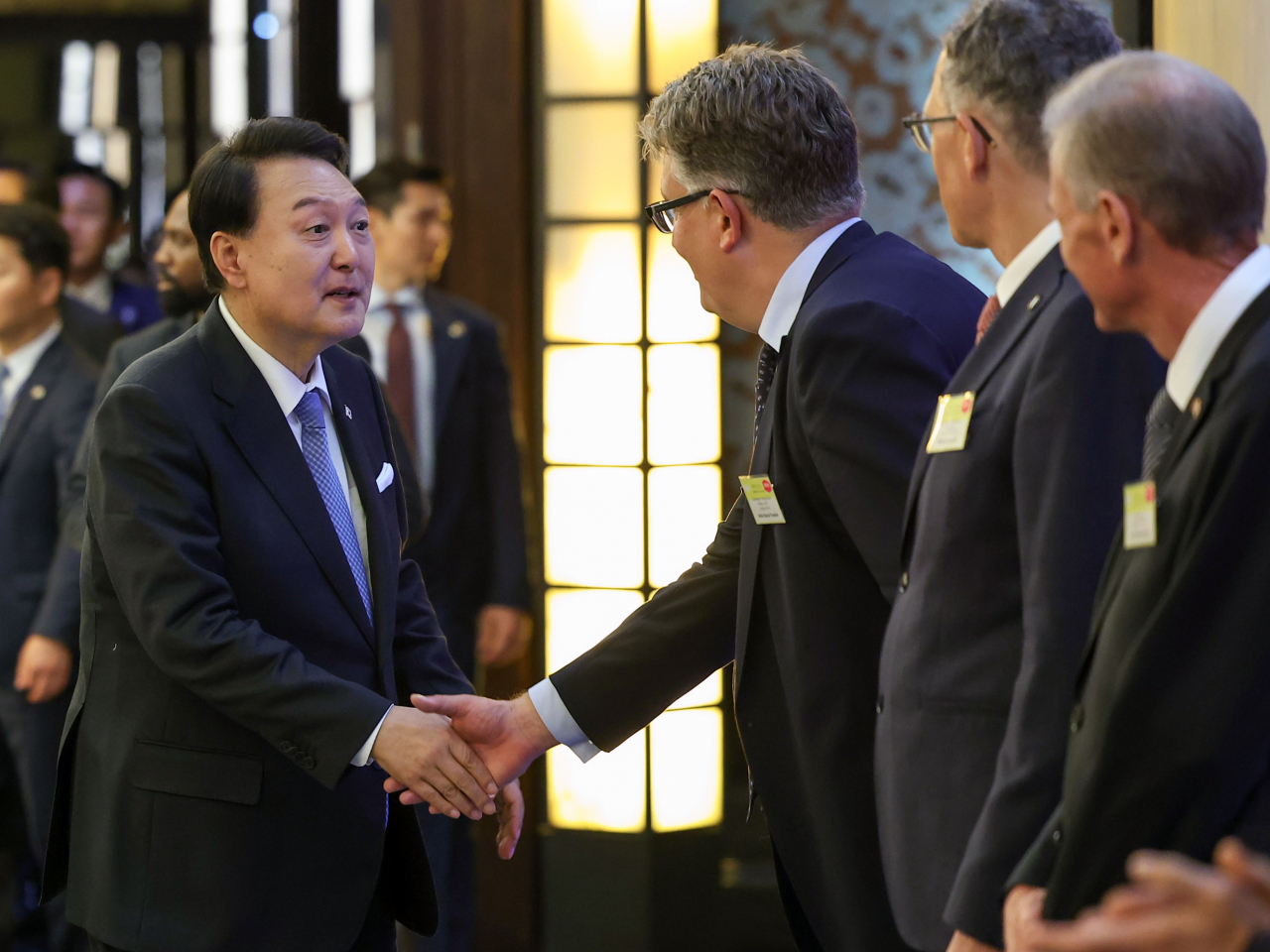 President Yoon Suk Yeol greets businessmen attending the investment ceremony for the European region, held at a hotel in Paris, France on Wednesday (local time). (Yonhap)