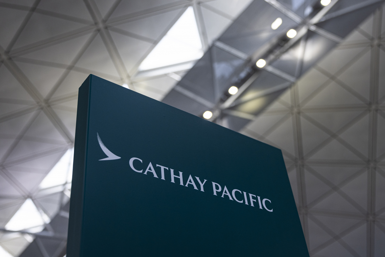 A signage for Cathay Pacific Airways at the departures hall of Hong Kong International Airport in Hong Kong. (AP-Yonhap)