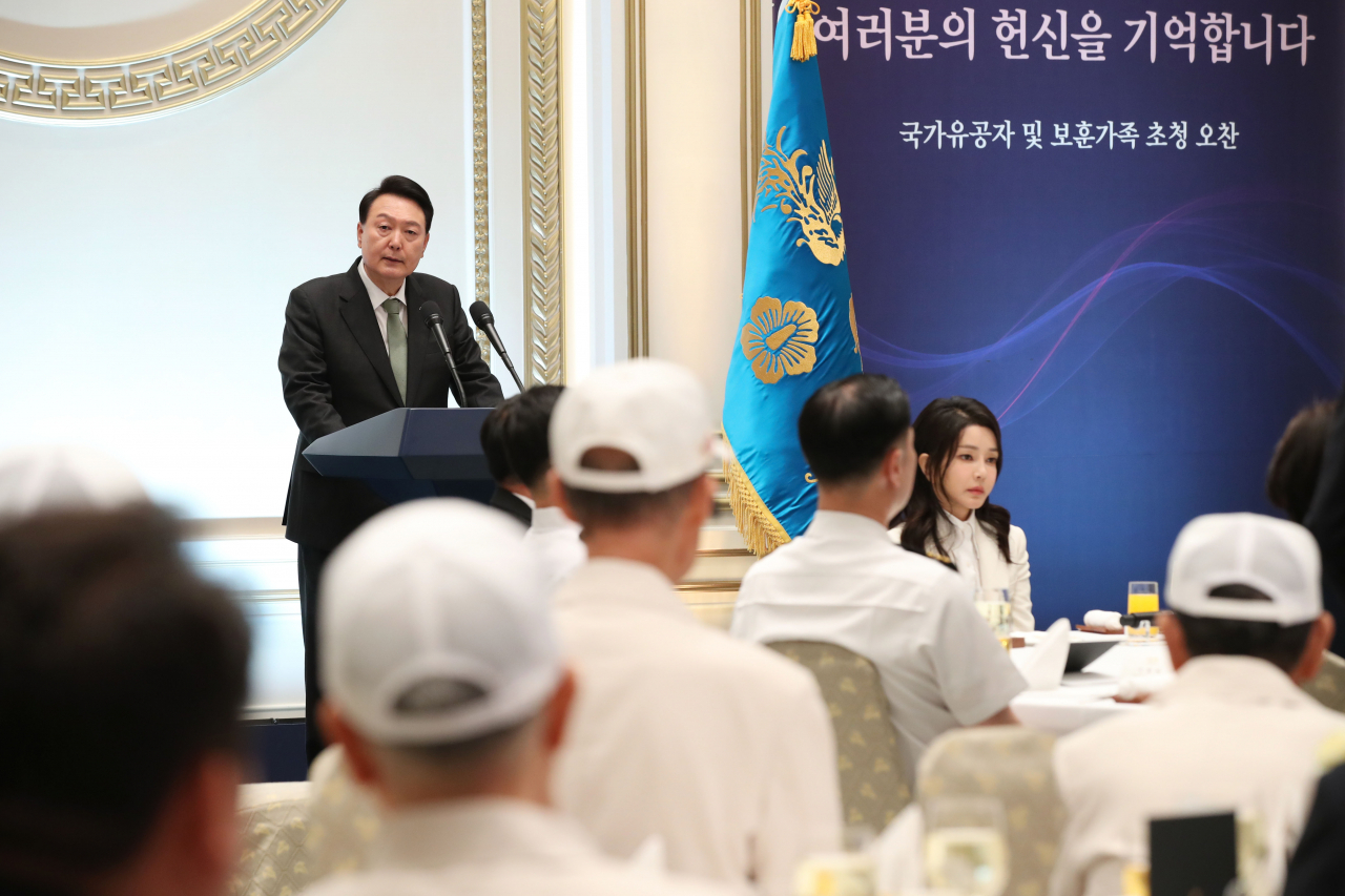 President Yoon Suk Yeol speaks during a luncheon meeting for people of national merit and their families at the former presidential office, Cheong Wa Dae, in Seoul on June 14. The meeting came ahead of the 73rd anniversary of the outbreak of the Korean War that falls on Sunday. (Yonhap)