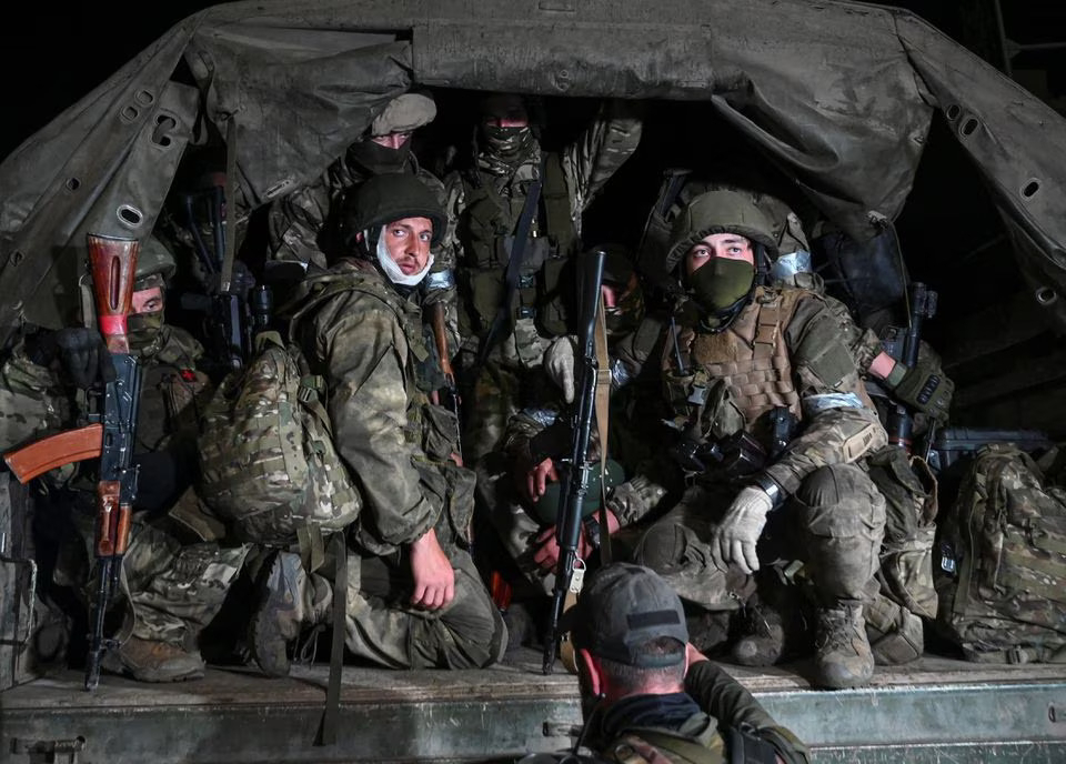 Fighters of Wagner private mercenary group pull out of the headquarters of the Southern Military District to return to base, in the city of Rostov-on-Don, Russia, on Saturday. (Reuters/Stringer)