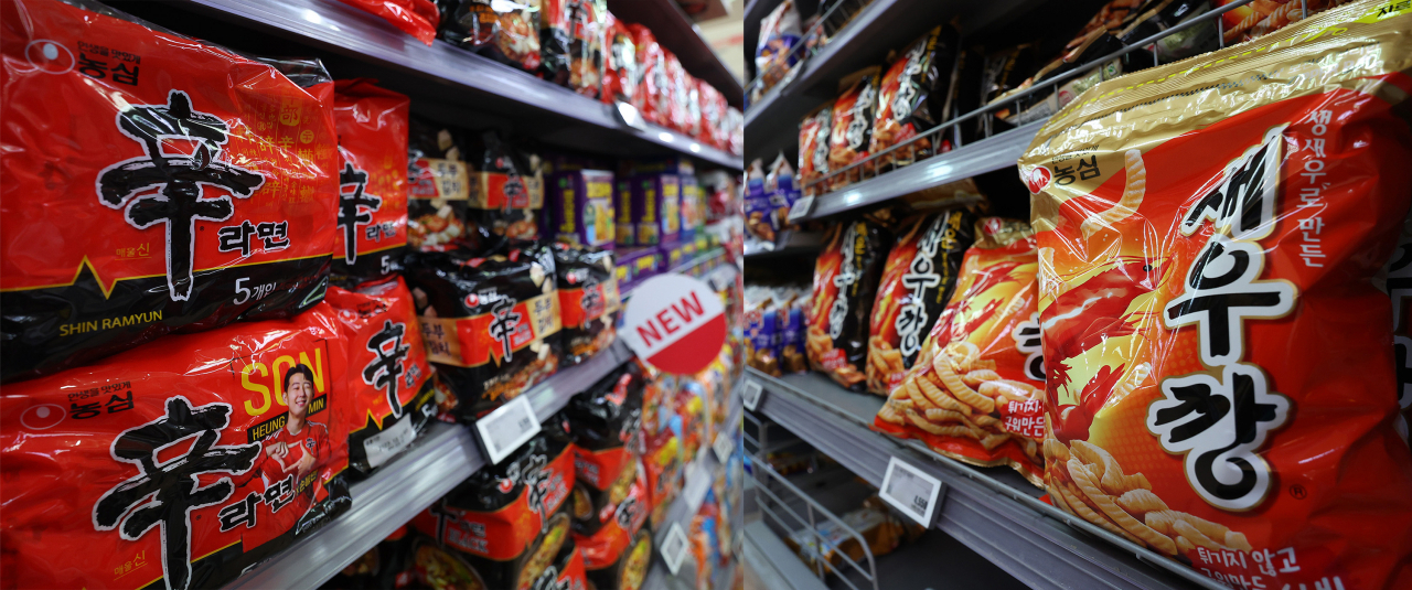 Nongshim products are on display at a supermarket in Seoul on Tuesday. The price of a single pack of Shin Ramyun instant noodles is expected to drop by 50 won (3.8 cents), while a bag of Saewookkang, a shrimp-flavored snack, is expected to drop by 100 won. (Yonhap)