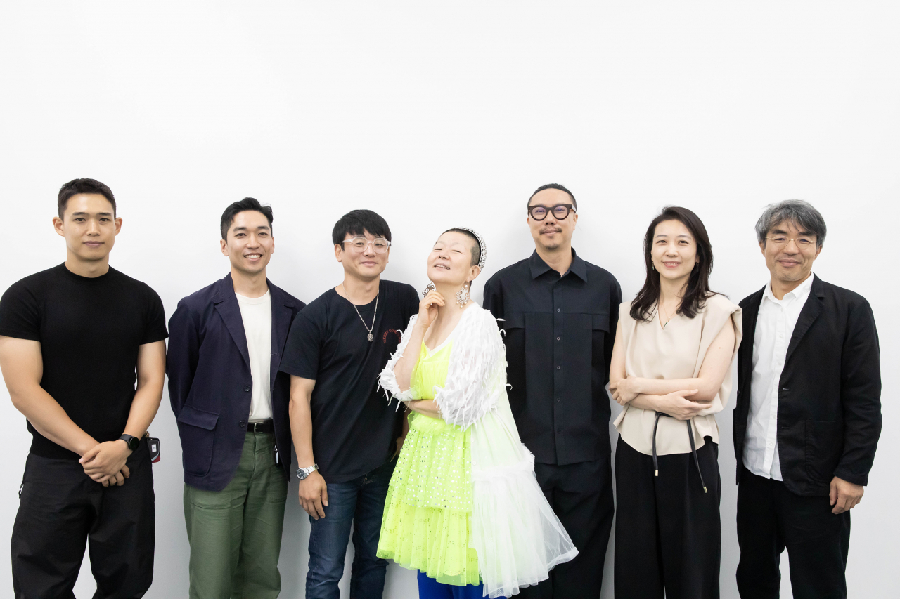 (From left) Media artist Kim Hee-cheon, Mover's artistic director Kim Seoljin, choreographer Kim Ki-su, choreographer Ahn Eun-me, new media artist Lee Jin-joon, KBS Symphony Orchestra's artistic planning team director Soh You-ri, and playwright Bae Sam-sik pose for photos after a press conference held at the Art Sonje Center, Seoul on Thursday. (KOFICE)
