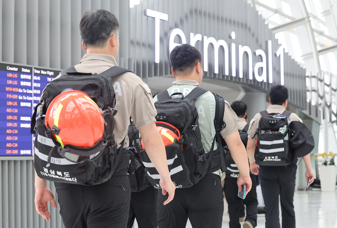 The Korea Disaster Relief Team heads to depart for Canada from Incheon Airport Terminal 1 on Sunday morning to help extinguish wildfires in Quebec. (Yonhap)