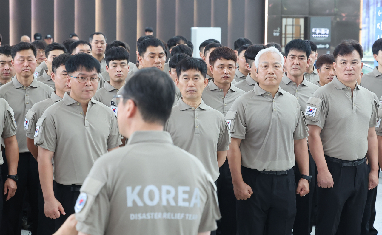 The Korea Disaster Relief Team listens to instructions in preparation for traveling to Quebec to support Canada's fire authorities in putting out wildfires there. (Yonhap)