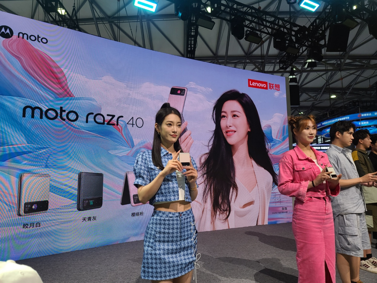 Models showcase Lenovo-owned Motorola's latest foldable smartphone series, Moto Razr 40 Ultra and Moto Razr 40, during the MWC Shanghai 2023 at Shanghai New International Expo Center, Shanghai, Friday. (Jie Ye-eun/The Korea Herald)
