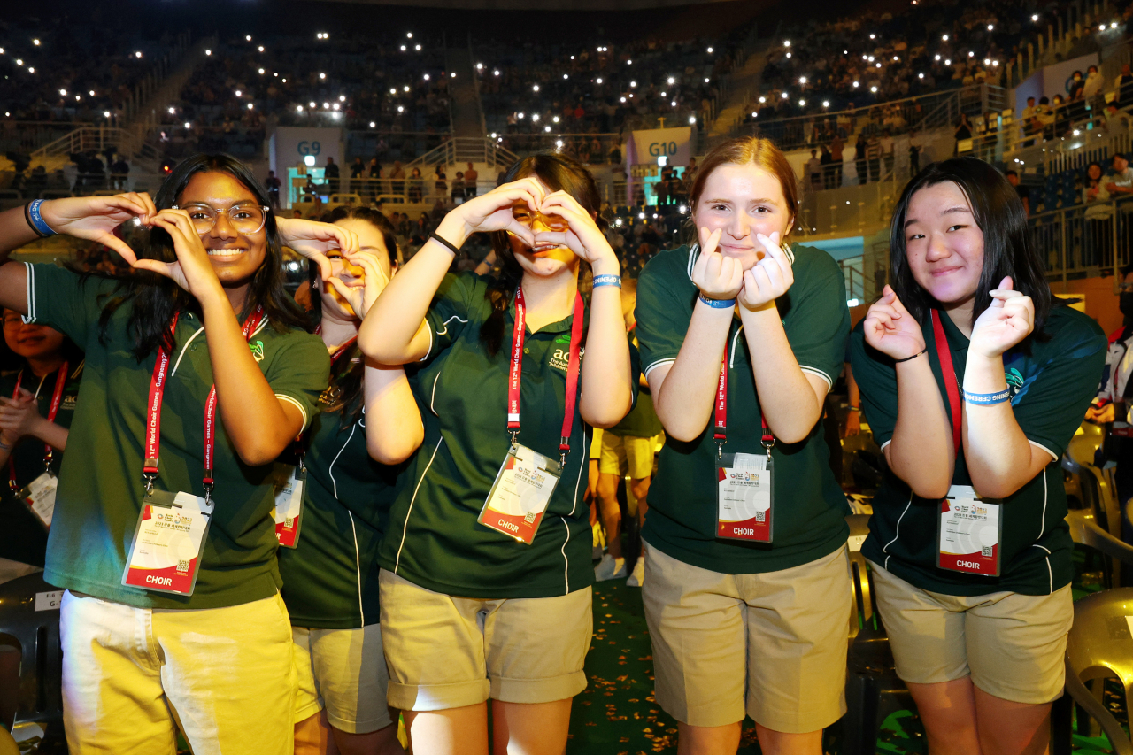 Members of the Australian Children's Choir pose for photos during the opening ceremony of the 12th World Choir Games in Gangneung Arena on Monday. (WCG 2023 Gangneung Organizing Committee)