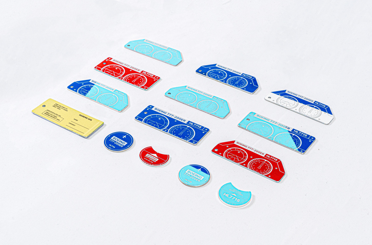 Luggage tags and golf ball markers made from upcycled aircraft parts (Korean Air)