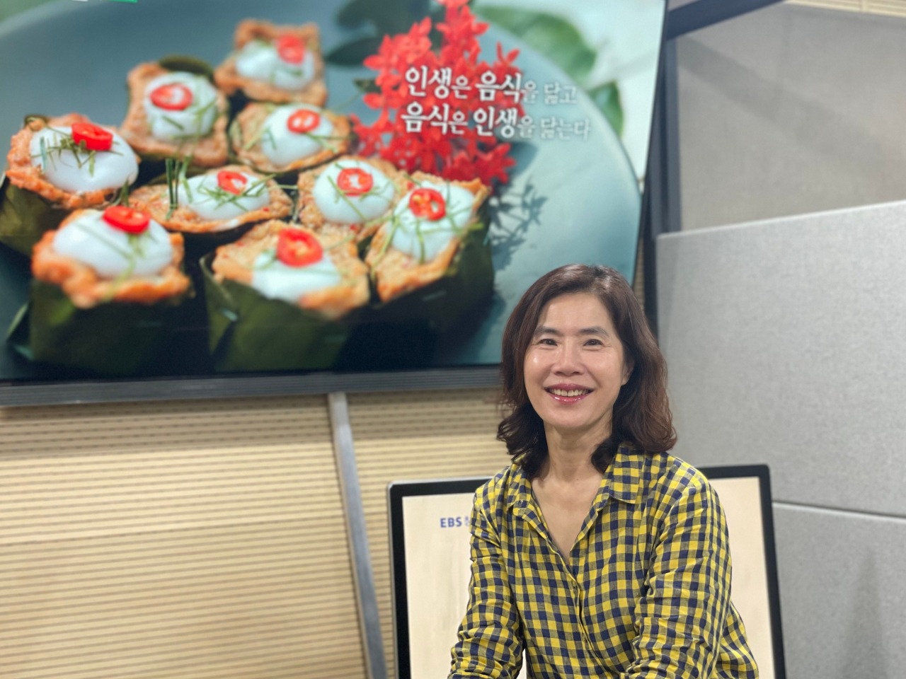 Documentary producer Chung Hyun-sook poses for a photo in her video editing office in Mapo-gu, western Seoul on Tuesday. (EBS)