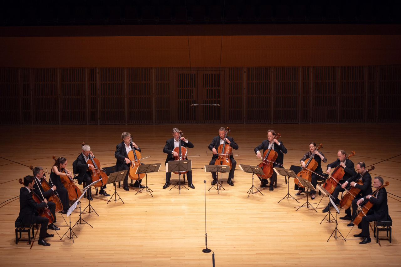 The 12 cellists of the Berlin Philharmonic Orchestra performs during a concert at Lotte Concert Hall in Jamsil, Seoul, on July 6. The 12 cellists have been performing since 1972 when they gathered for a radio production of Julius Klengel’s Hymnus for 12 Cellos. (Yonhap)