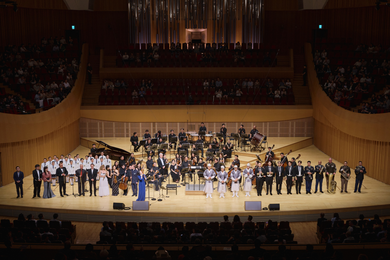 Participants of the Opening Gala Peace Concert of the 2023 Gonjiam Music Festival greet the audience during a curtain call on Monday at Lotte Concert Hall in Jamsil, Seoul. (Gonjiam Musical Festival)