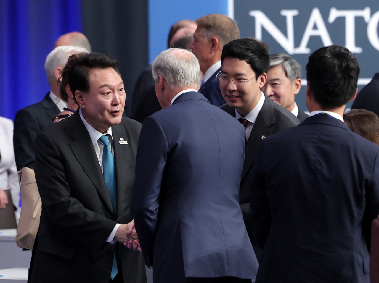 South Korean President Yoon Suk Yeol (L, front) greets other participants during a summit of the North Atlantic Treaty Organization (NATO) and the Asia-Pacific Partnership, or AP4, a group of NATO's four key Asia-Pacific partner countries -- South Korea, Japan, Australia and New Zealand -- in Vilnius, Lithuania, on Wednesday. (Pool photo -Yonhap)