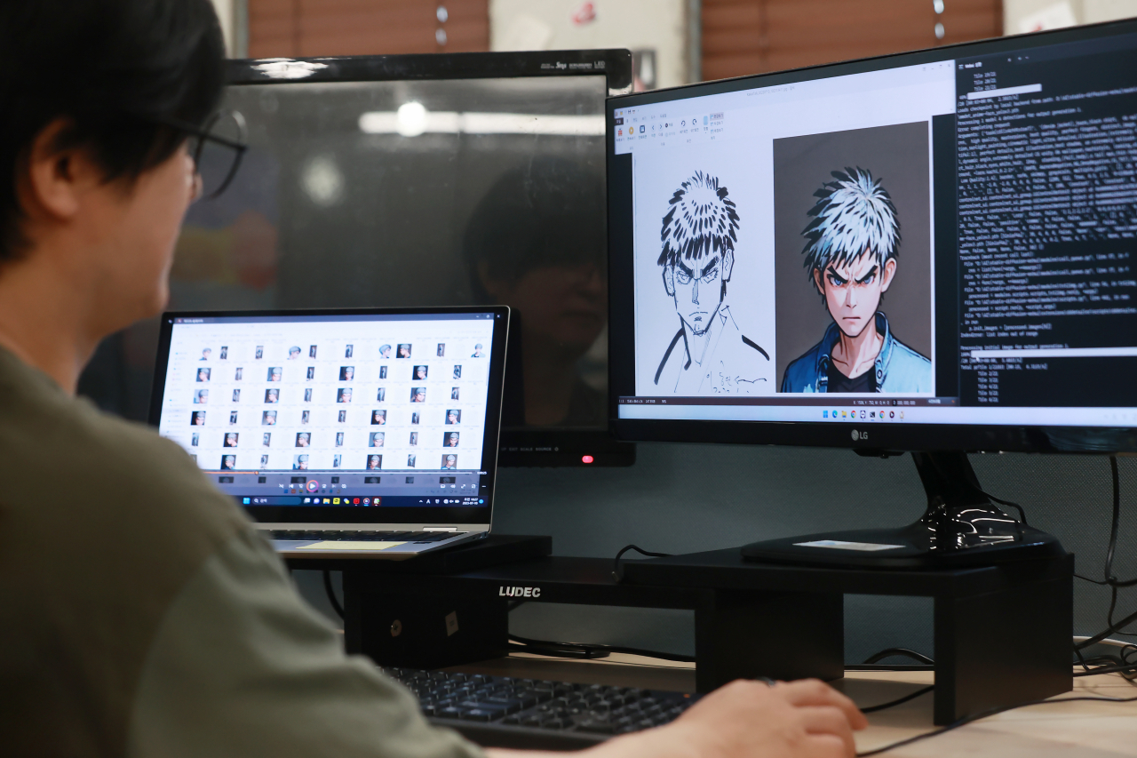 A Jaedam Media Corp. official works on a remake of a character from “The High School Baseball Team” at the company’s office in Mapo-gu, western Seoul, July 10. (Yonhap)