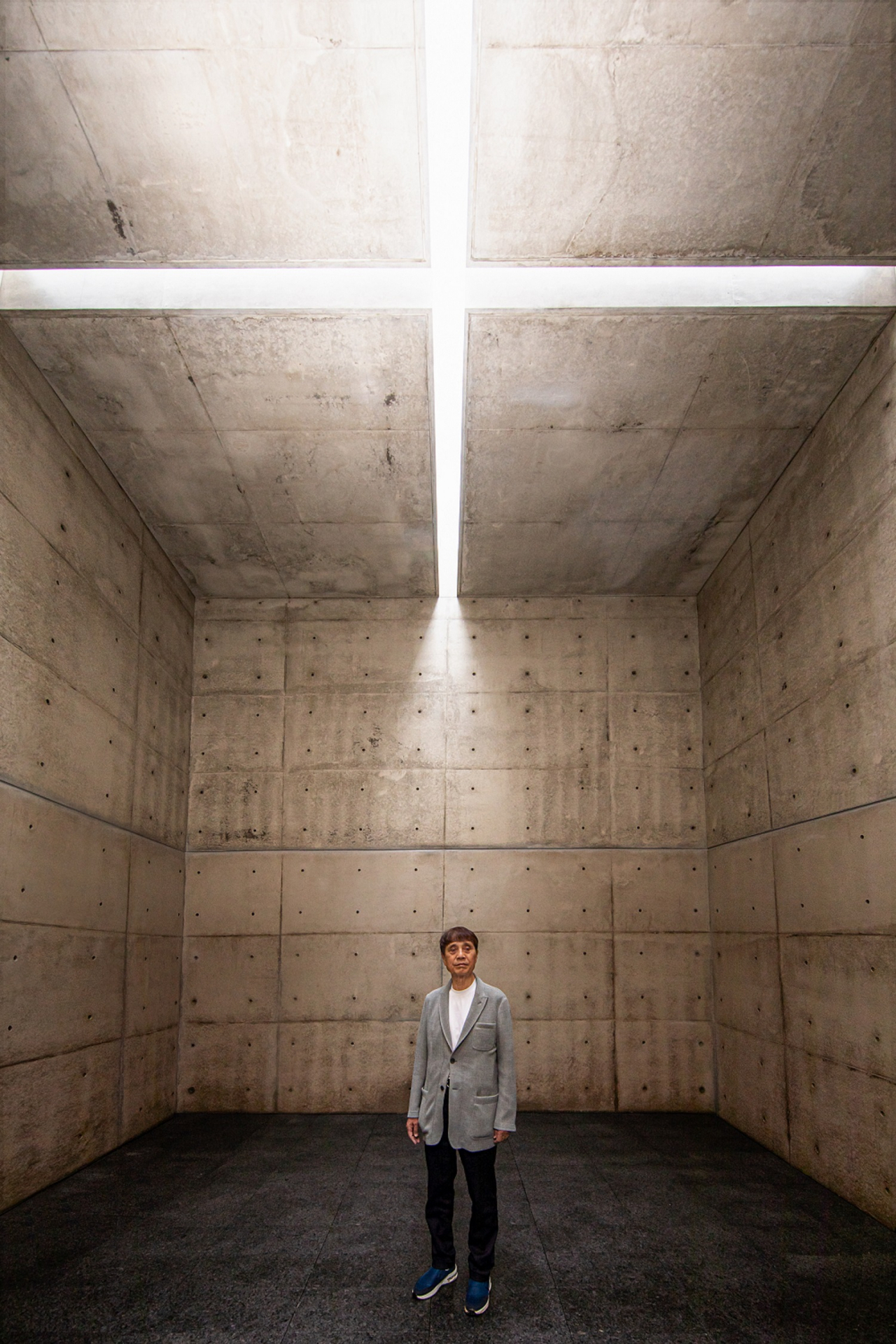 Japanese architect Tadao Ando stands in 