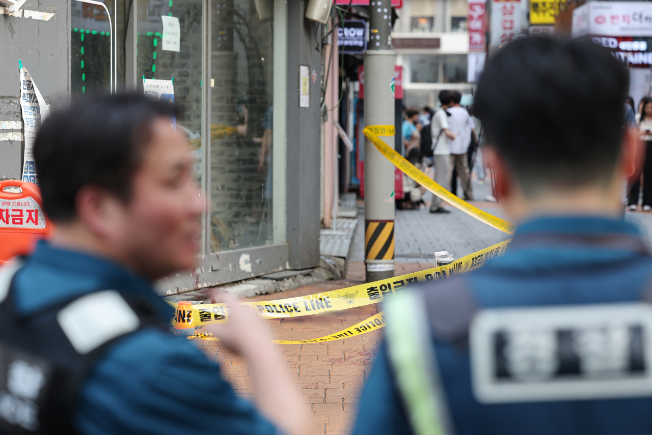 This photo shows the scene of the crime demarcated by yellow tape near Sillim subway station in Gwanak-gu, Seoul, on Saturday. (Yonhap)