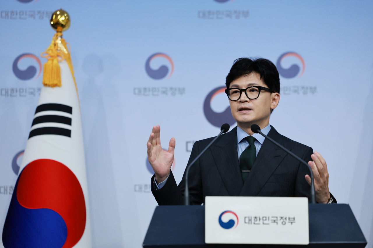 Justice Minister Han Dong-hoon briefs the media at the government complex in Seoul on July 18. (Yonhap)
